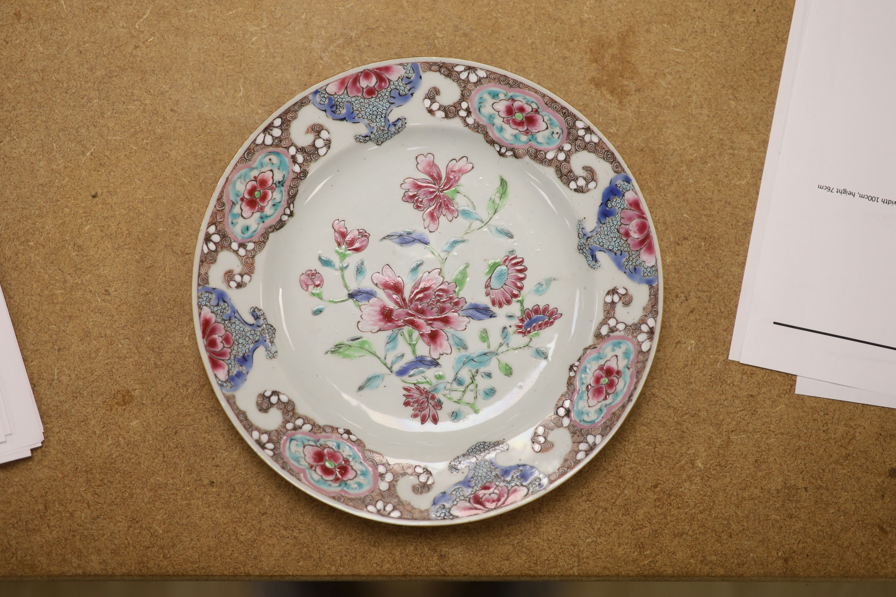 A pair of 18th century Chinese famille rose plates and another similar, largest diameter 22.5cm (damage)